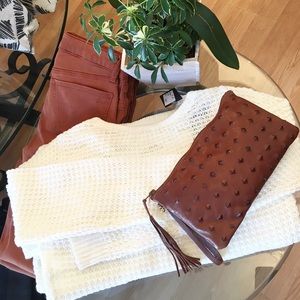 Sweater $68 Denim $125 Italian leather clutch $120